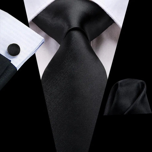 Black tie made from jacquard woven silk. Includes matching cuff links and pocket square