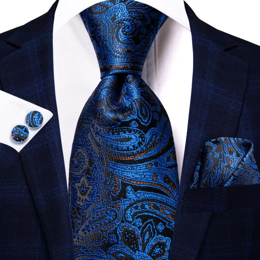 blue and black paisley tie with matching cuff links and pocket square