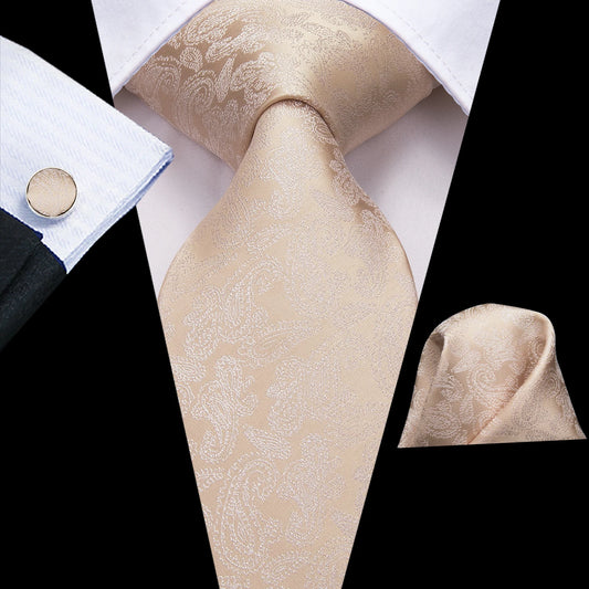 cream colour paisley tie with cuff links and pocket square