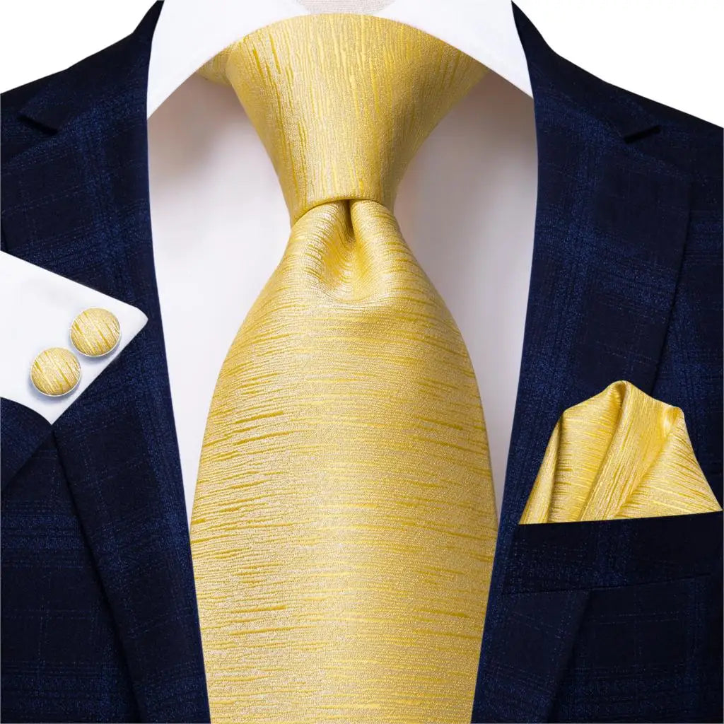 gold textured design tie with cuff links and pocket square