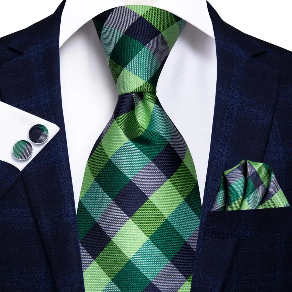 green and blue check pattern tie with matching cuff links and pocket square