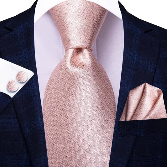 light pink geometric design tie with cuff links and pocket square