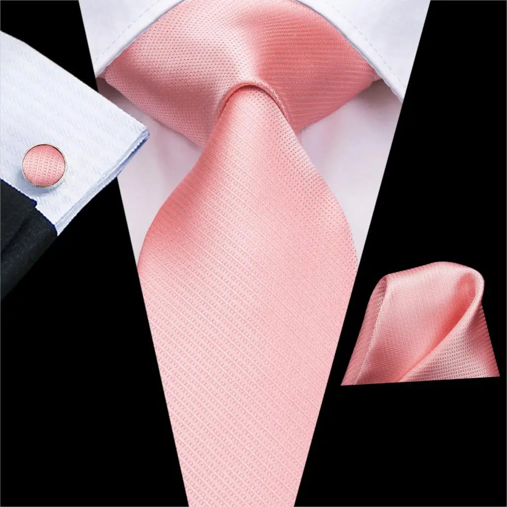 light pink tie with matching cuff links and pocket square