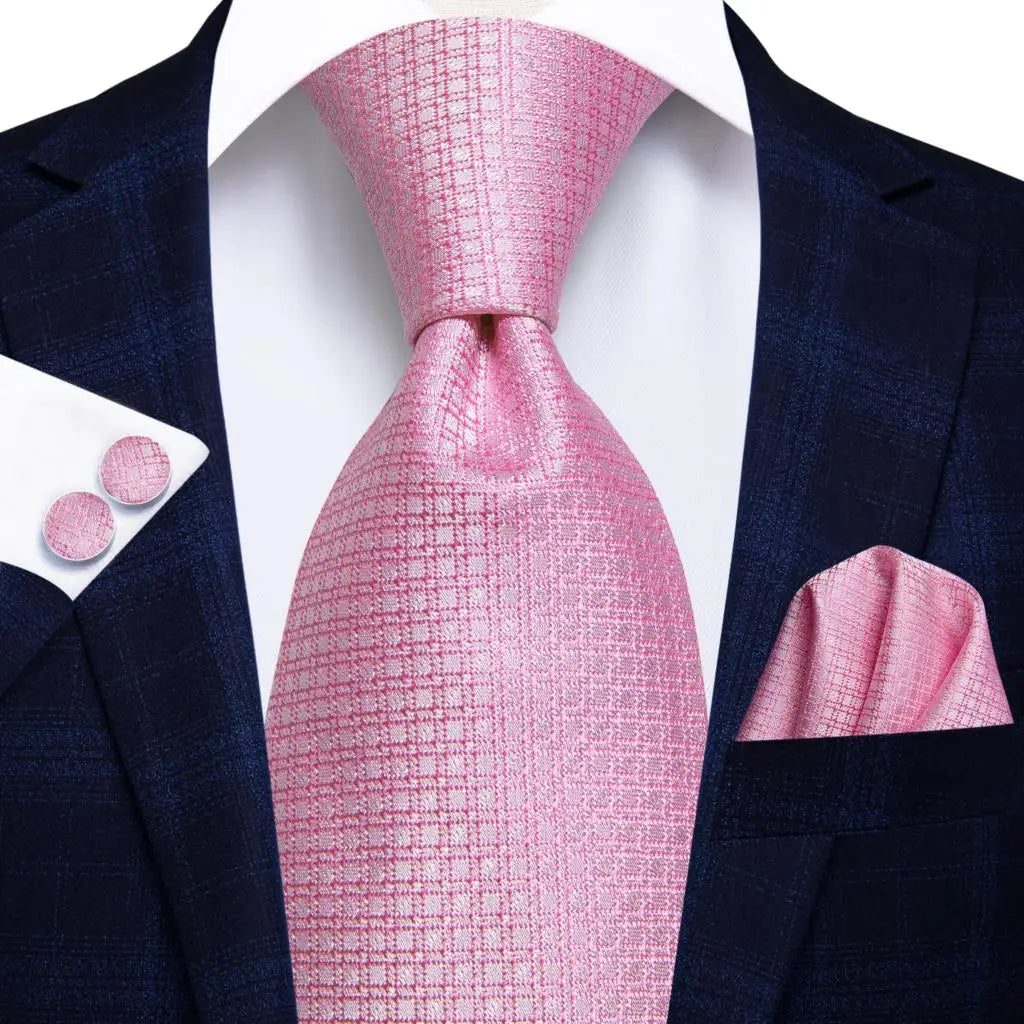 pink geometric design silk tie with matching cuff links and pocket square