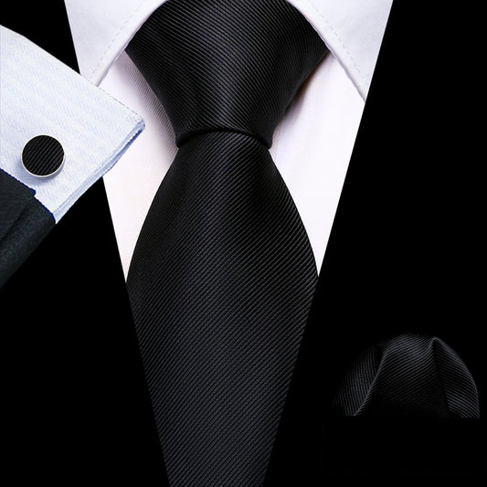 plain black tie with matching cuff links and pocket square