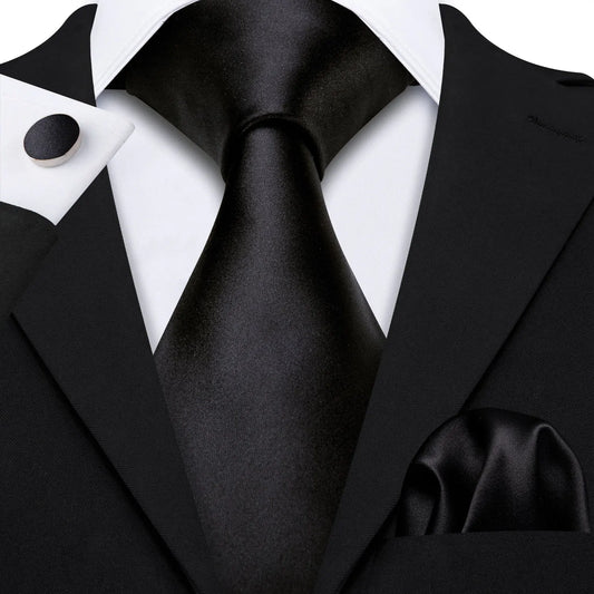 plain black tie with matching cuff links and pocket square