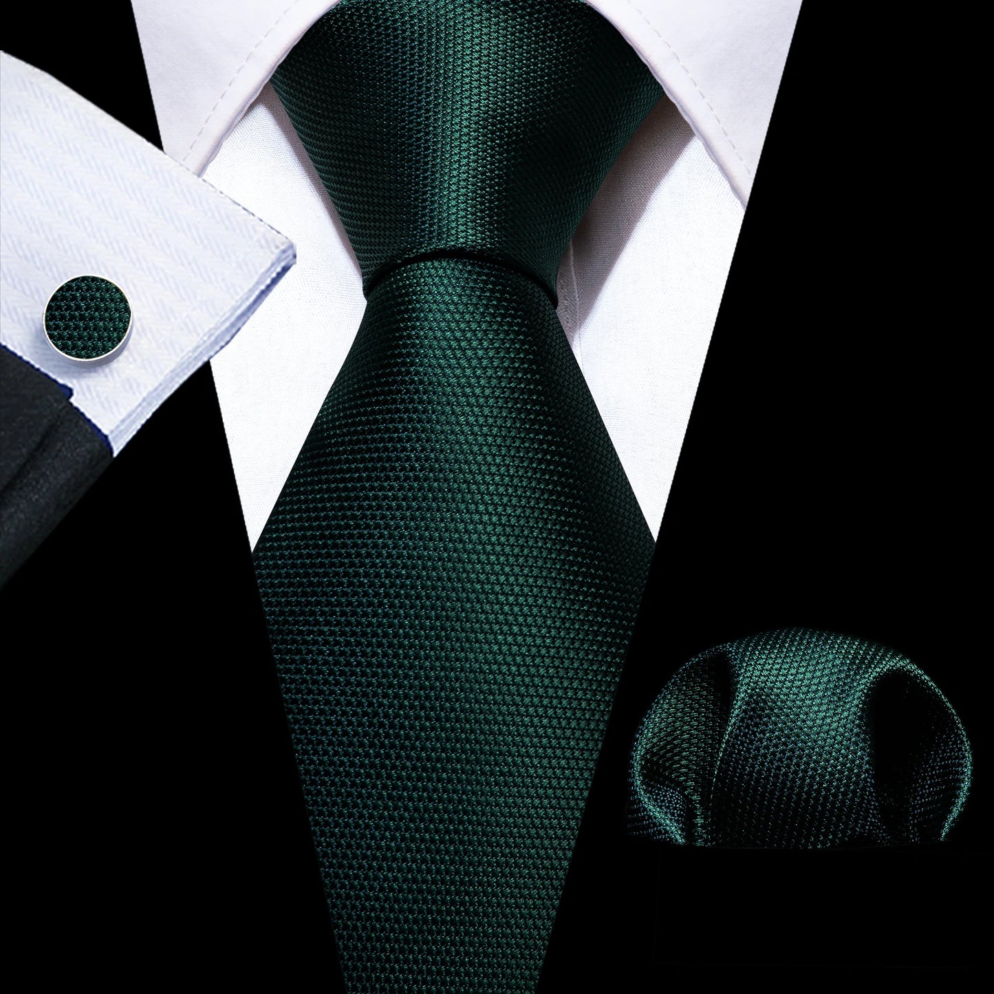 plain dark green tie with matching cuff links and pocket square