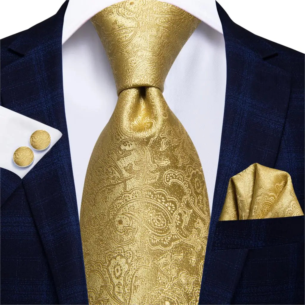 plain gold paisley tie with cuff links and pocket square