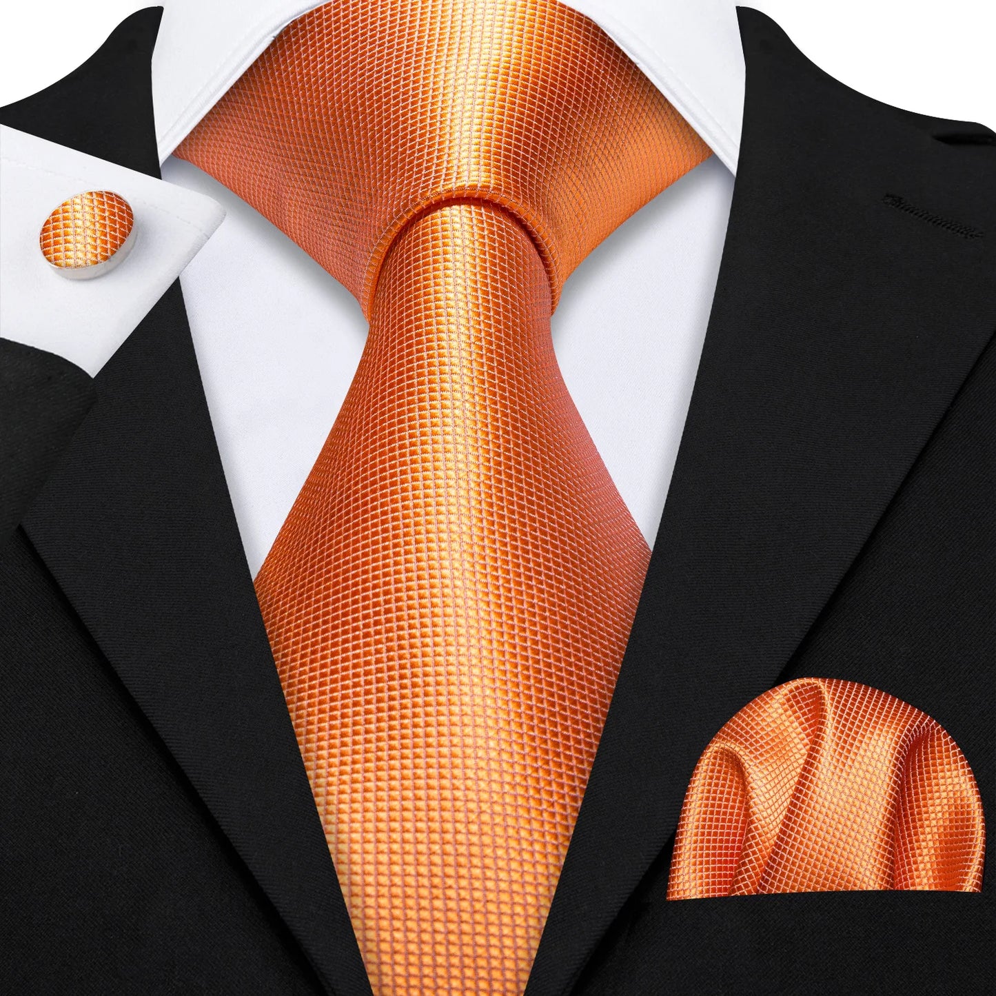 plain orange tie with matching cuff links and pocket square