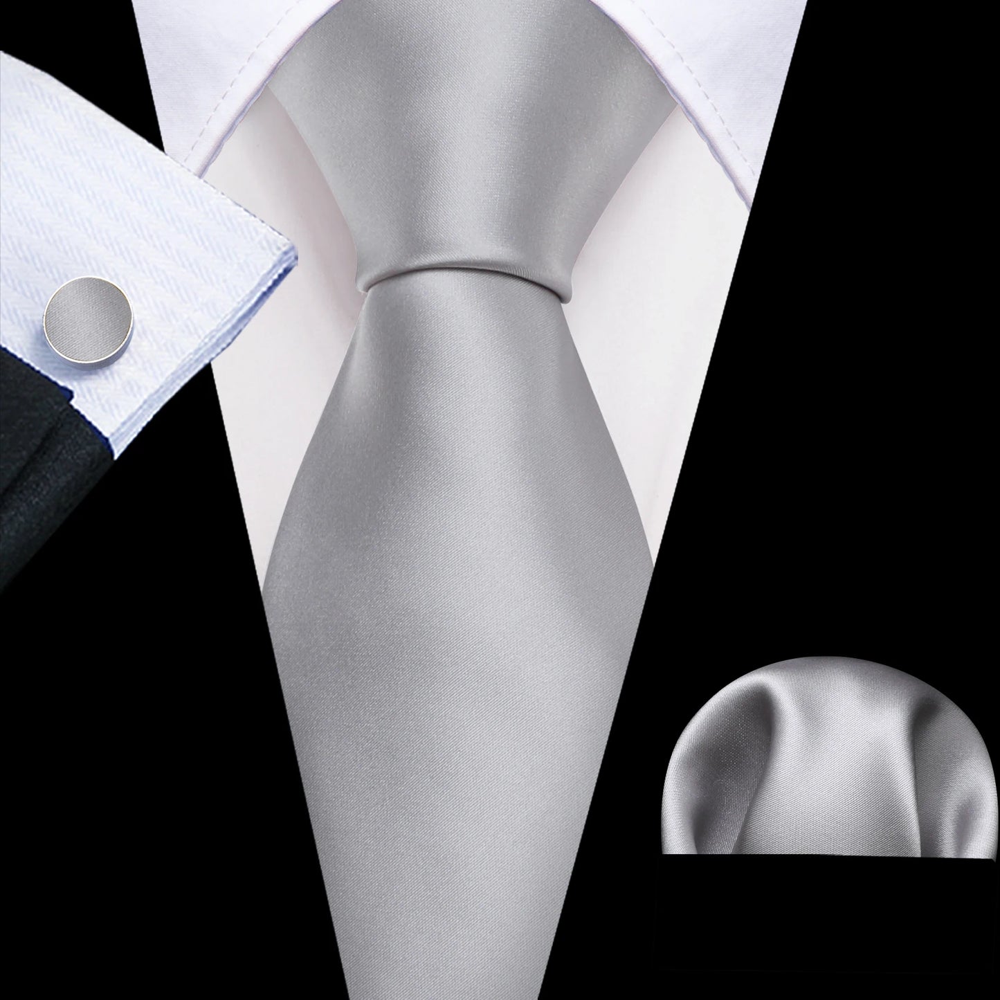 plain silver tie with cuff links and pocket square