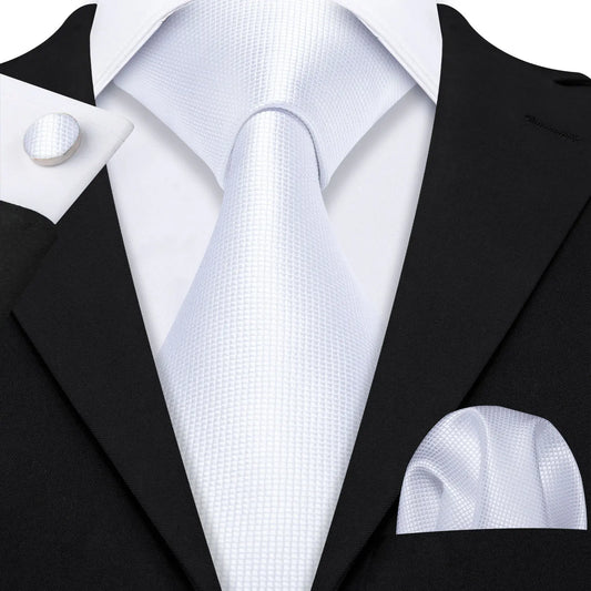 plain white textured tie with cuff links and pocket square