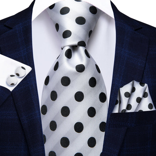 silver and black polka dot pattern tie with matching cuff links and pocket square